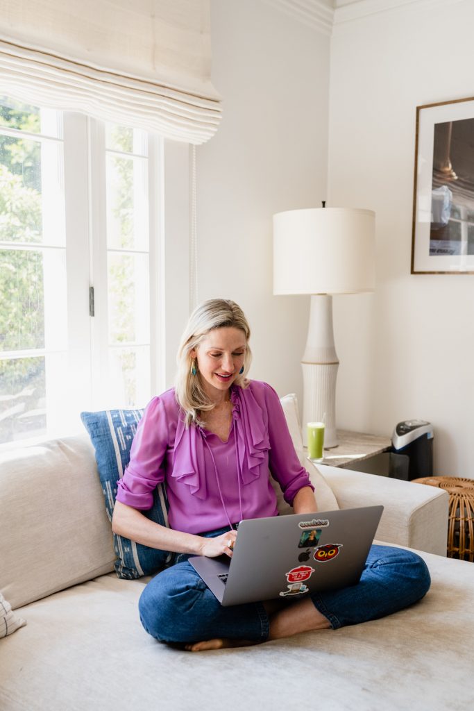 Catherine McCord typing on computer couch_email anxiety