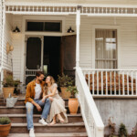 Couple sitting on front porch.