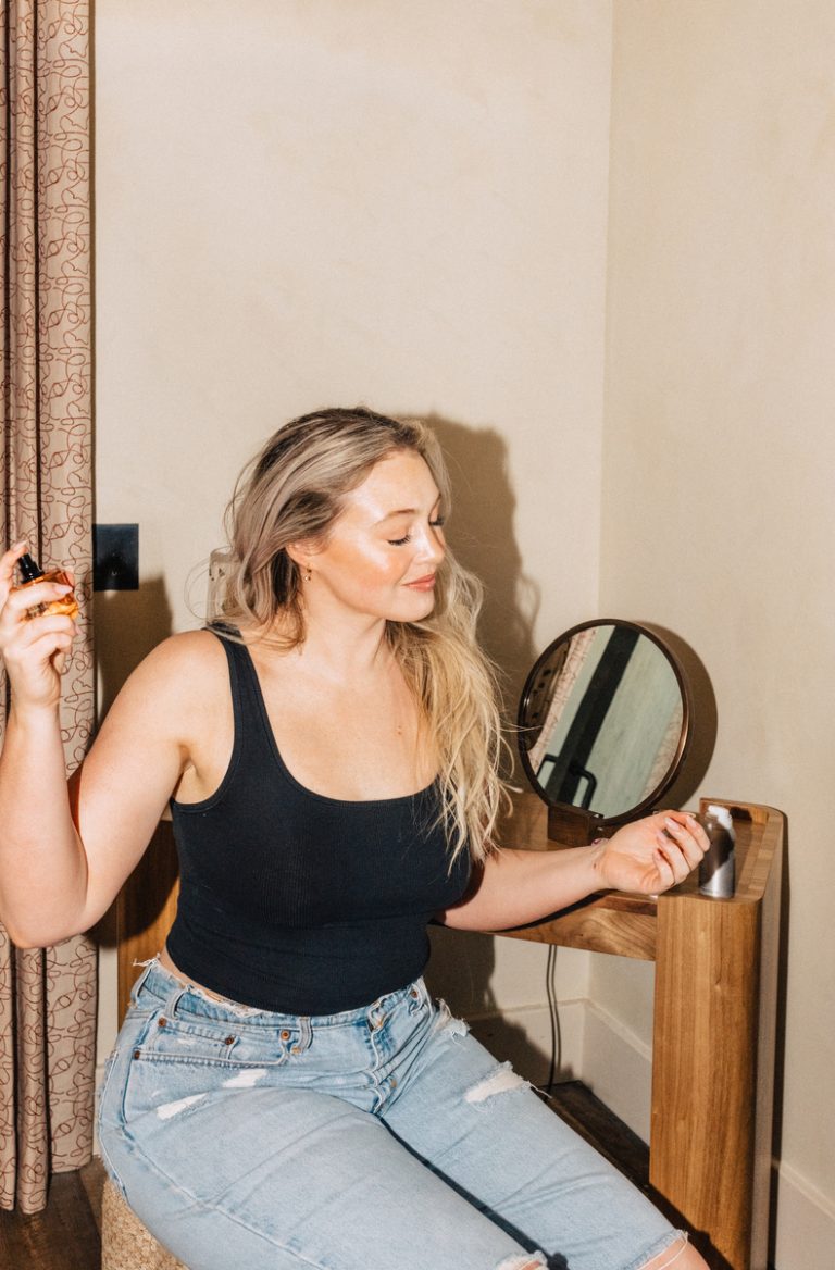 clean fragrance brands_iskra lawrence puts on perfume