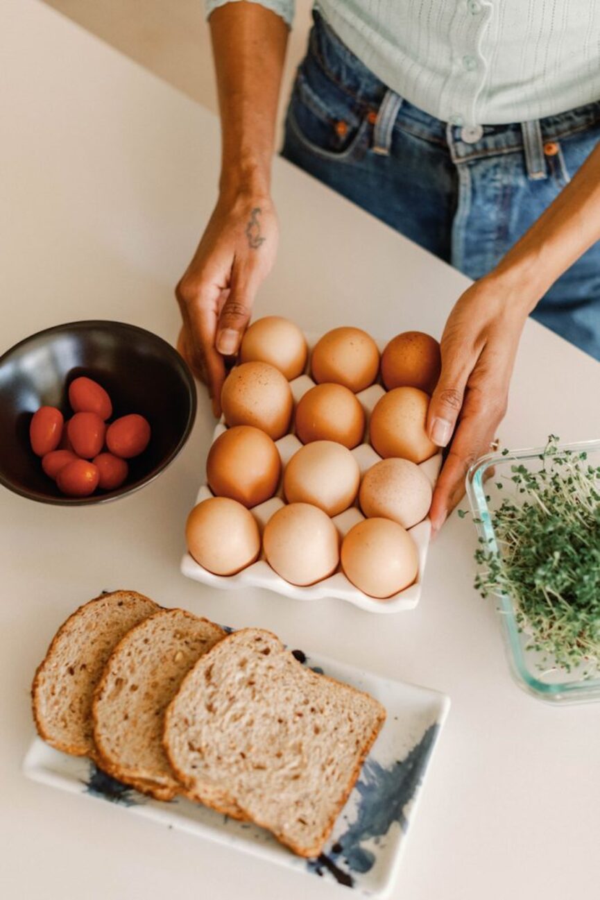 eggs on counter with bread and tomatoes_healthy eating habits