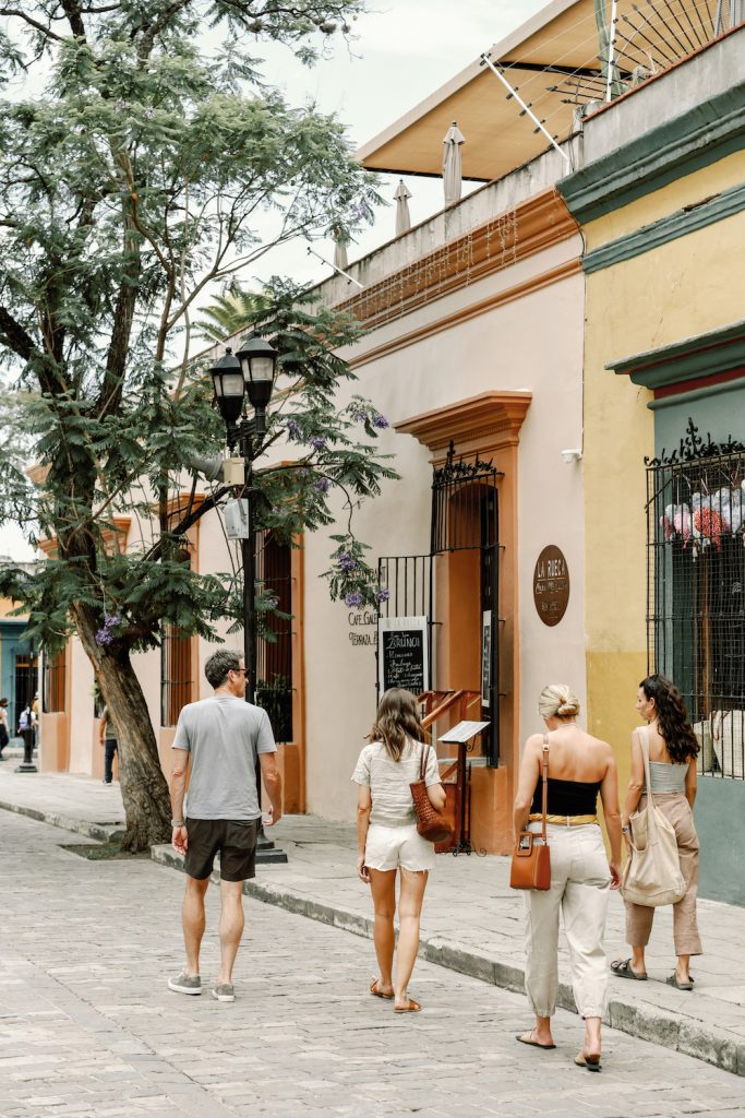 group of people walking in Oaxaca daily steps