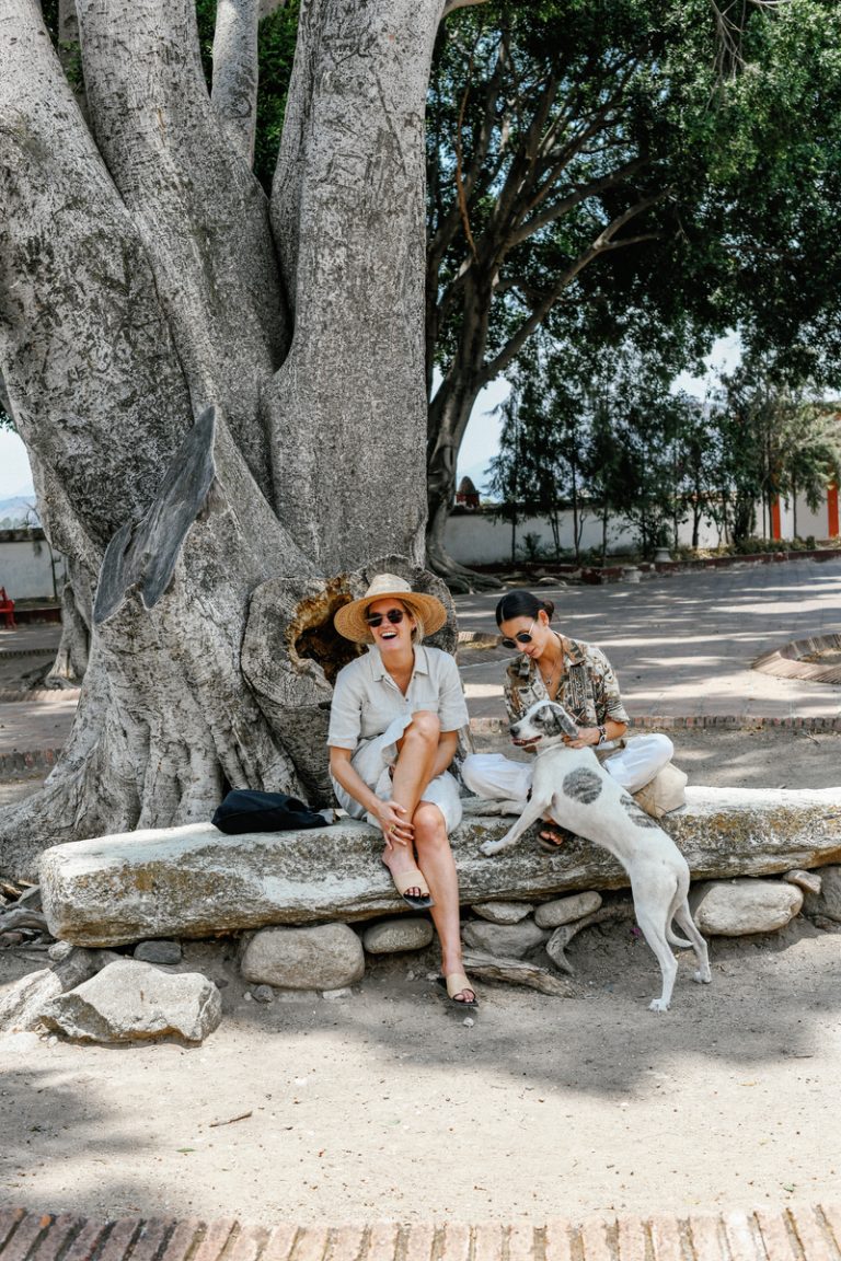 two women petting dog in Oaxaca_little Saturday