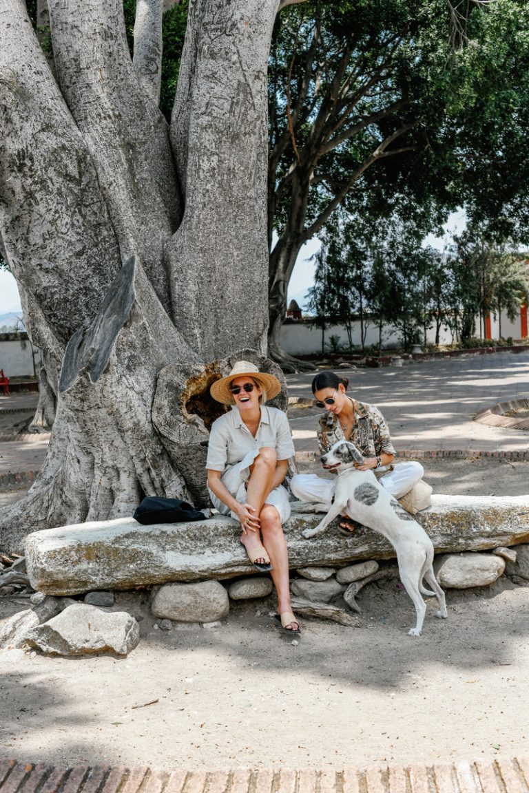 two women petting a dog at Oaxaca_little Saturday