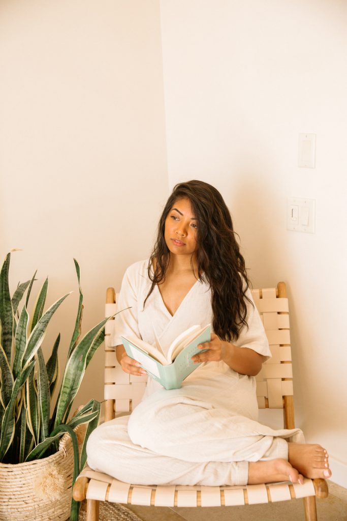 woman reading outside_the best books to read in your 30s
