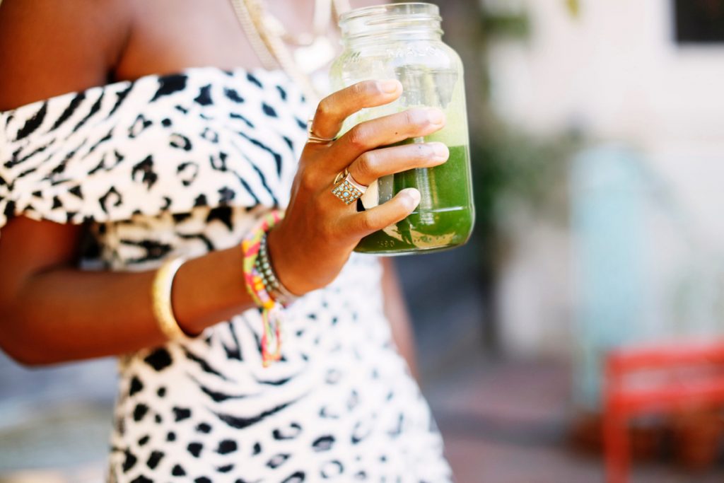 Megan O'Neill holding green smoothie_best hand creams for dry skin