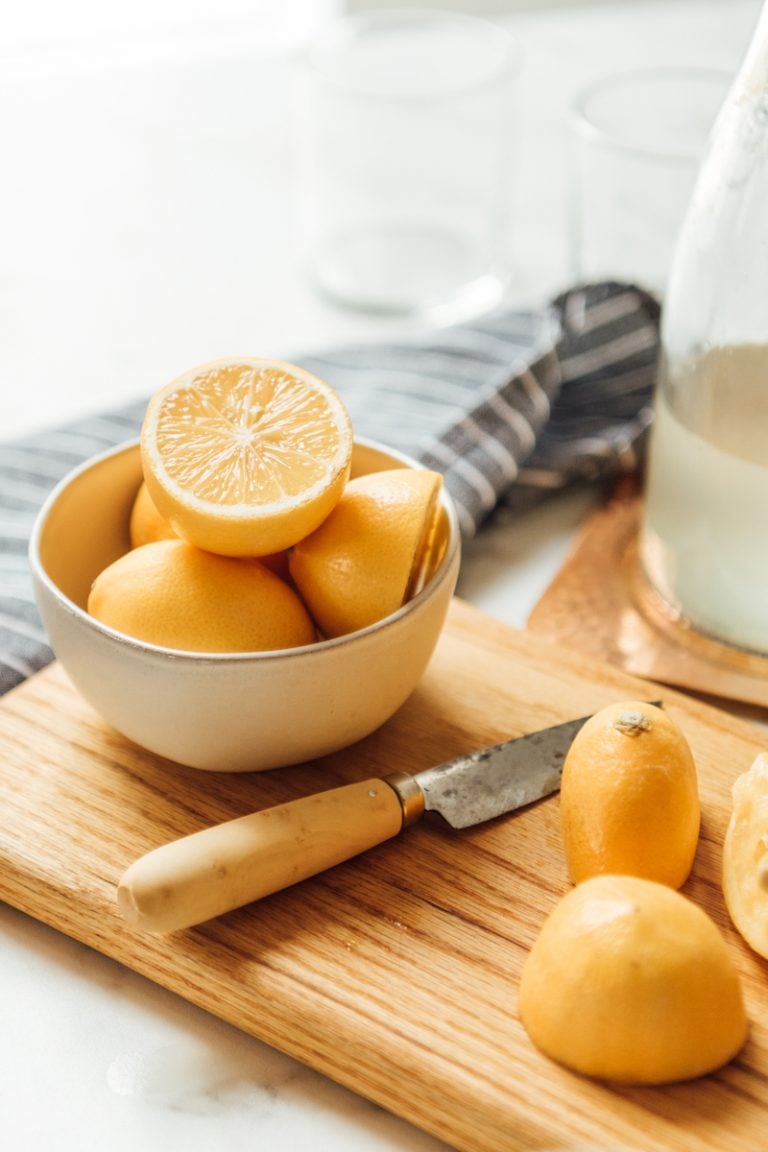 Ashleigh Amoroso happy hour lemons on cutting board_benefits of lemon water in the morning