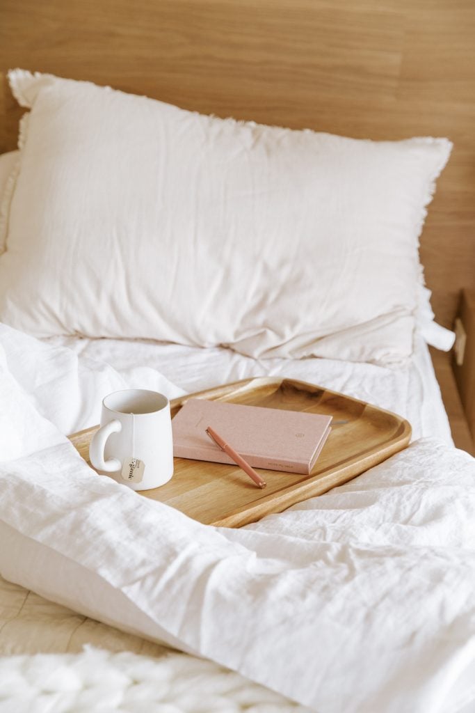 journaling and drinking tea in bed_ ways to curb your sugar cravings