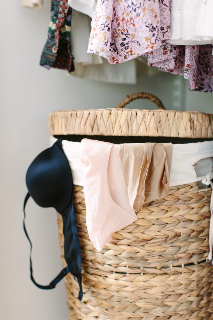 bra and laundry hanging out of laundry basket_best nontoxic laundry detergents