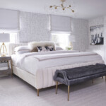 light gray bedroom with stool