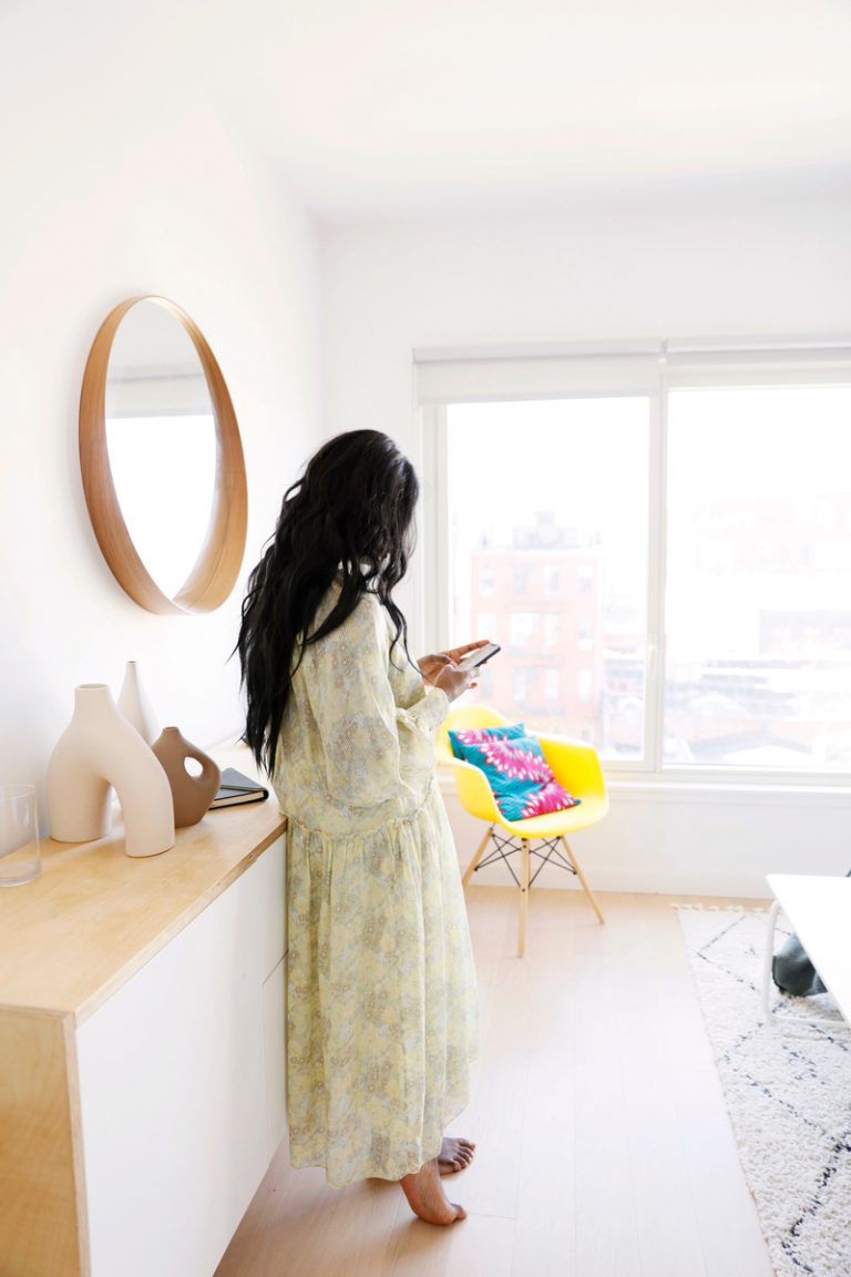 Marie Kouadio Amouzame on phone in bedroom_foods that lower estrogen