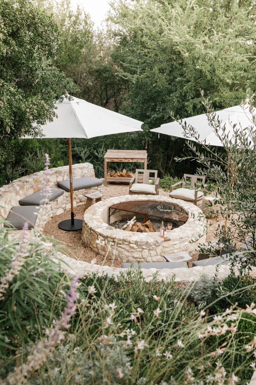 camille styles backyard fire pit with umbrellas
