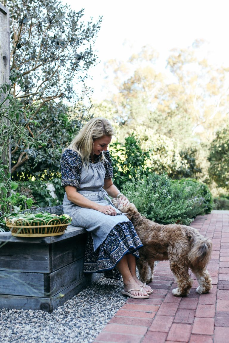 Valerie Rice petting dog in Santa Barbara_eat organic