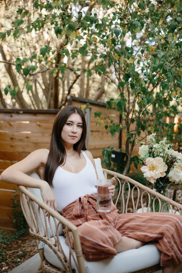 woman drinking water outside_foods that lower estrogen