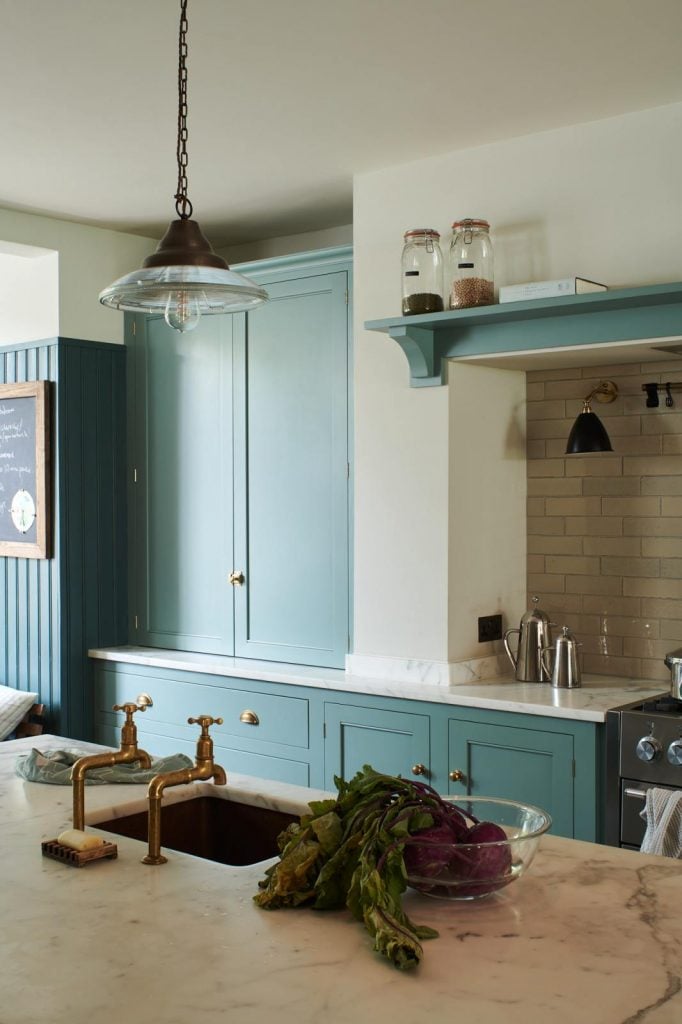 english kitchen with blue cabinets