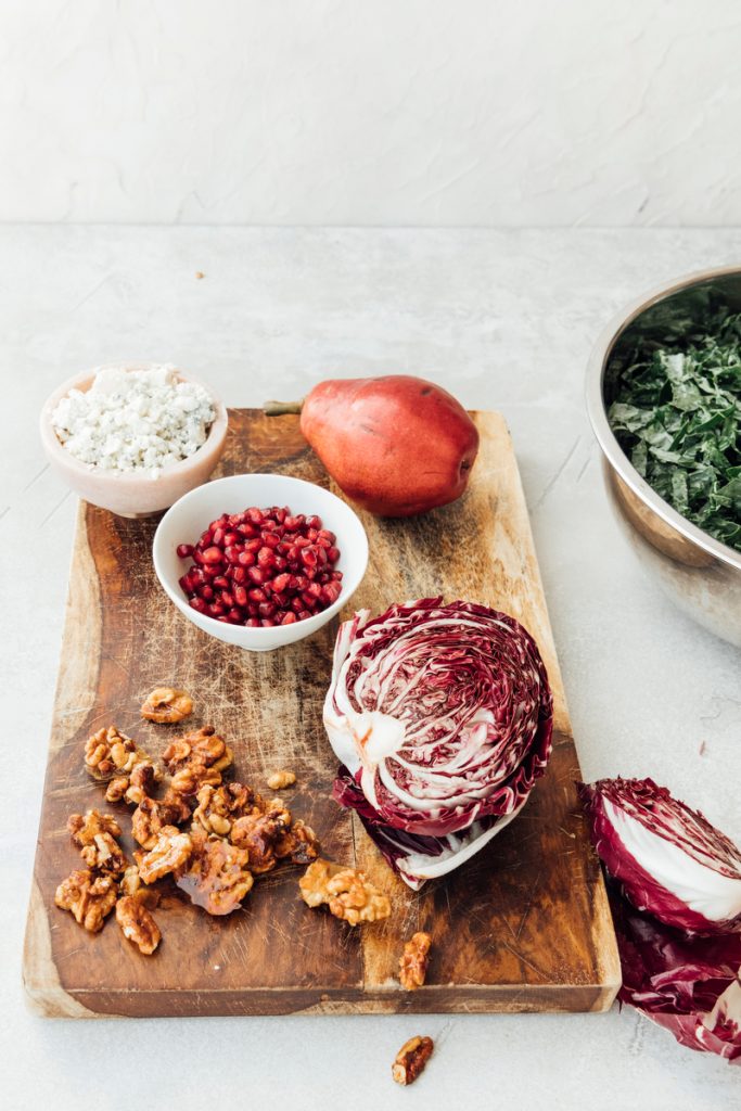 walnuts, pomegranate seeds, cheese, pears, and raddichio kale salad ingredients