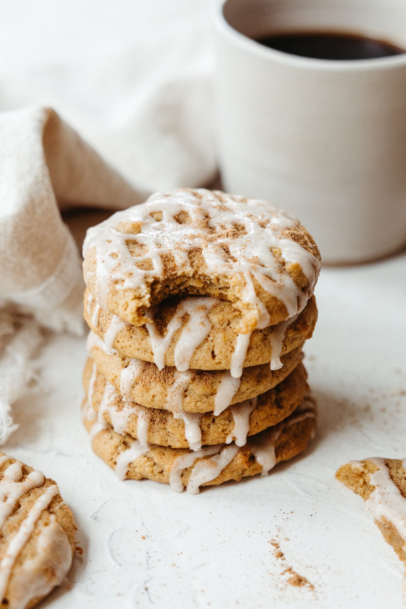 one bowl chewy pumpkin spice cookies with cinnamon glaze, coffee