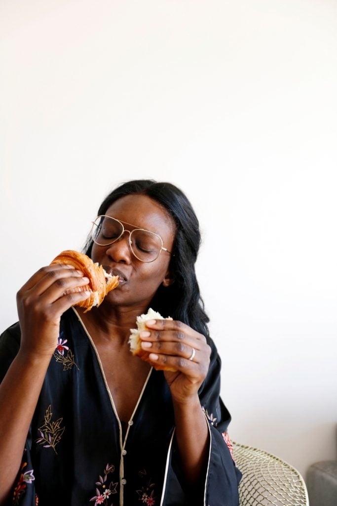 Marie-Kouadio-Amouzame eating croissant