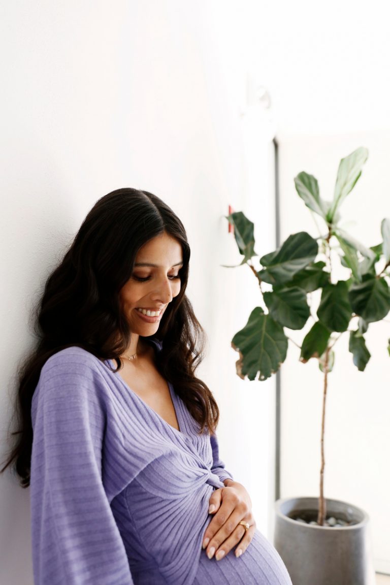 woman wearing purple dress, how to boost fertility