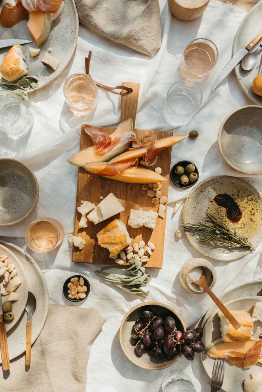 summer dinner party table with melon cheese charcuterie, casa zuma