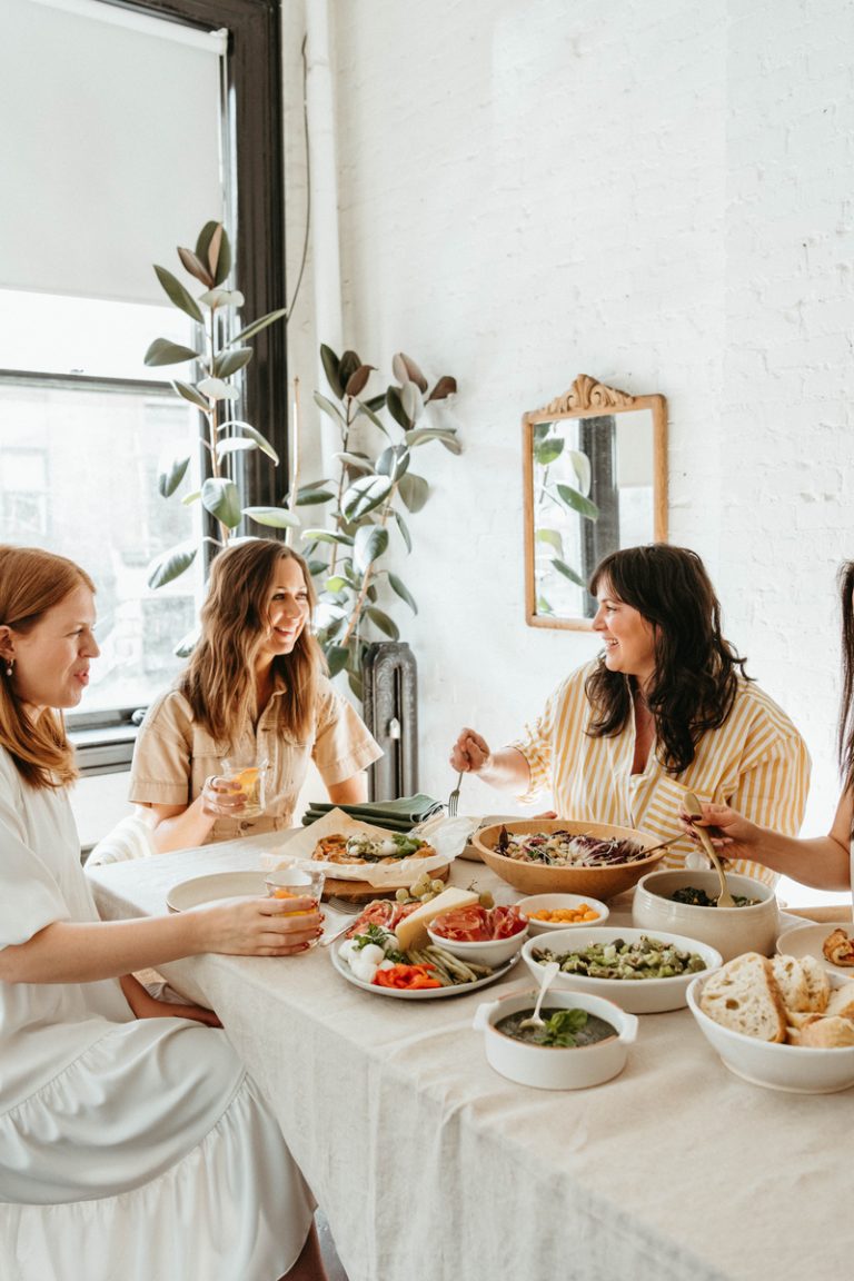 Women eating at dinner table.
