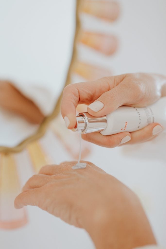 Inge Theron applying moisturizer to hand_skincare routine for sensitive skin