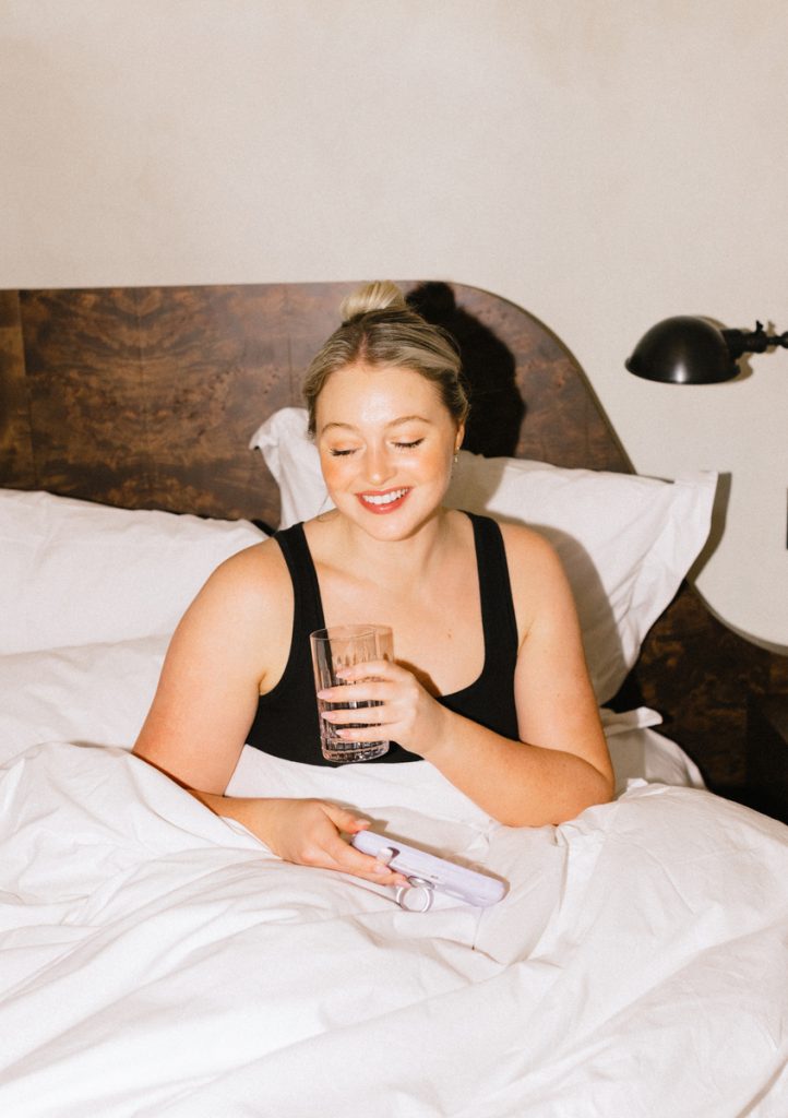 Inge Theron drinking water in bed_skincare routine for sensitive skin