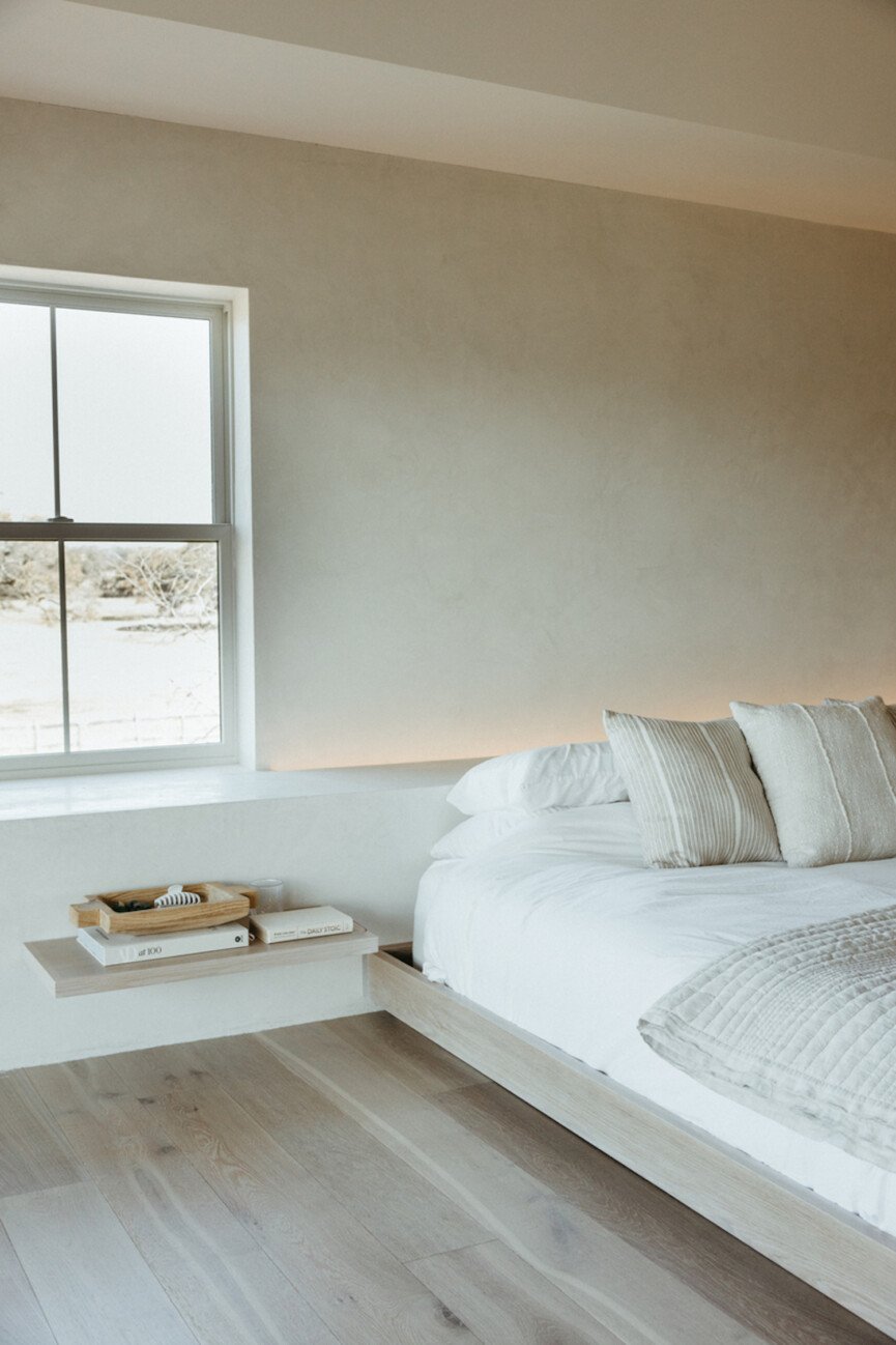 Minimalist bedroom painted in calming bedroom colors.