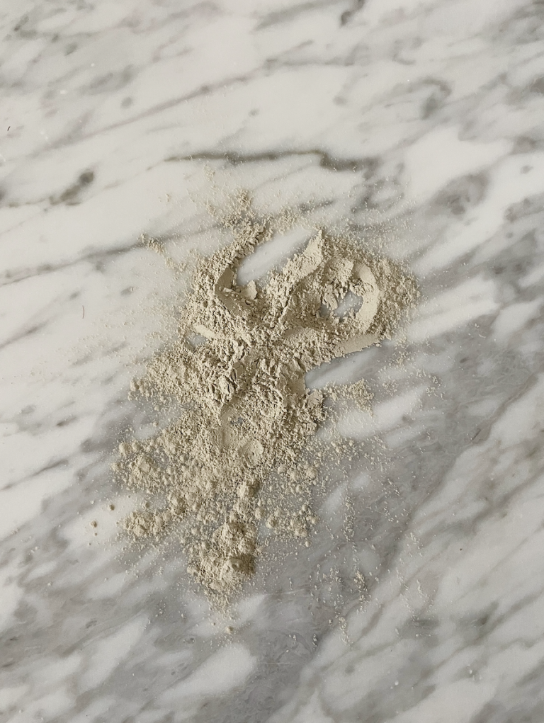 a clay mask on marble countertop