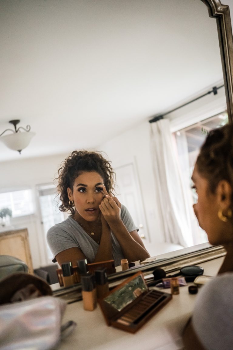 Simone Boyce putting on makeup