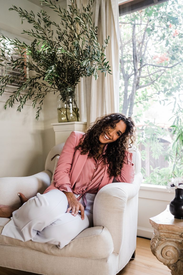 Simone Boyce smiling in living room_low maintenance wash day