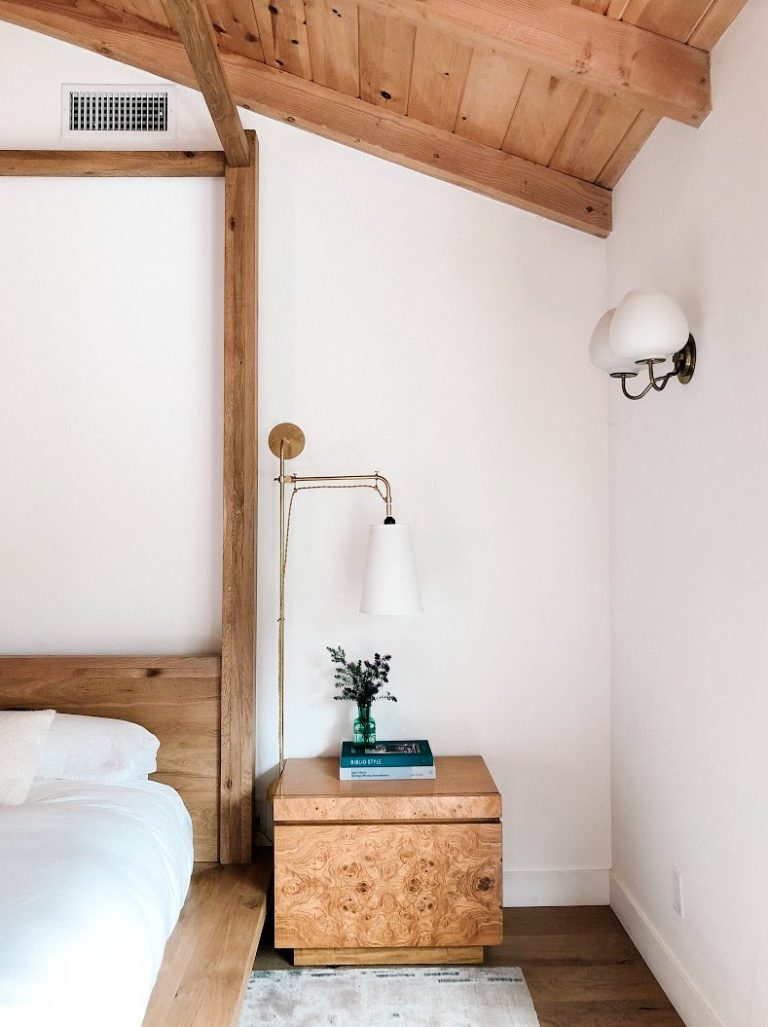 white bedroom with wood ceiling