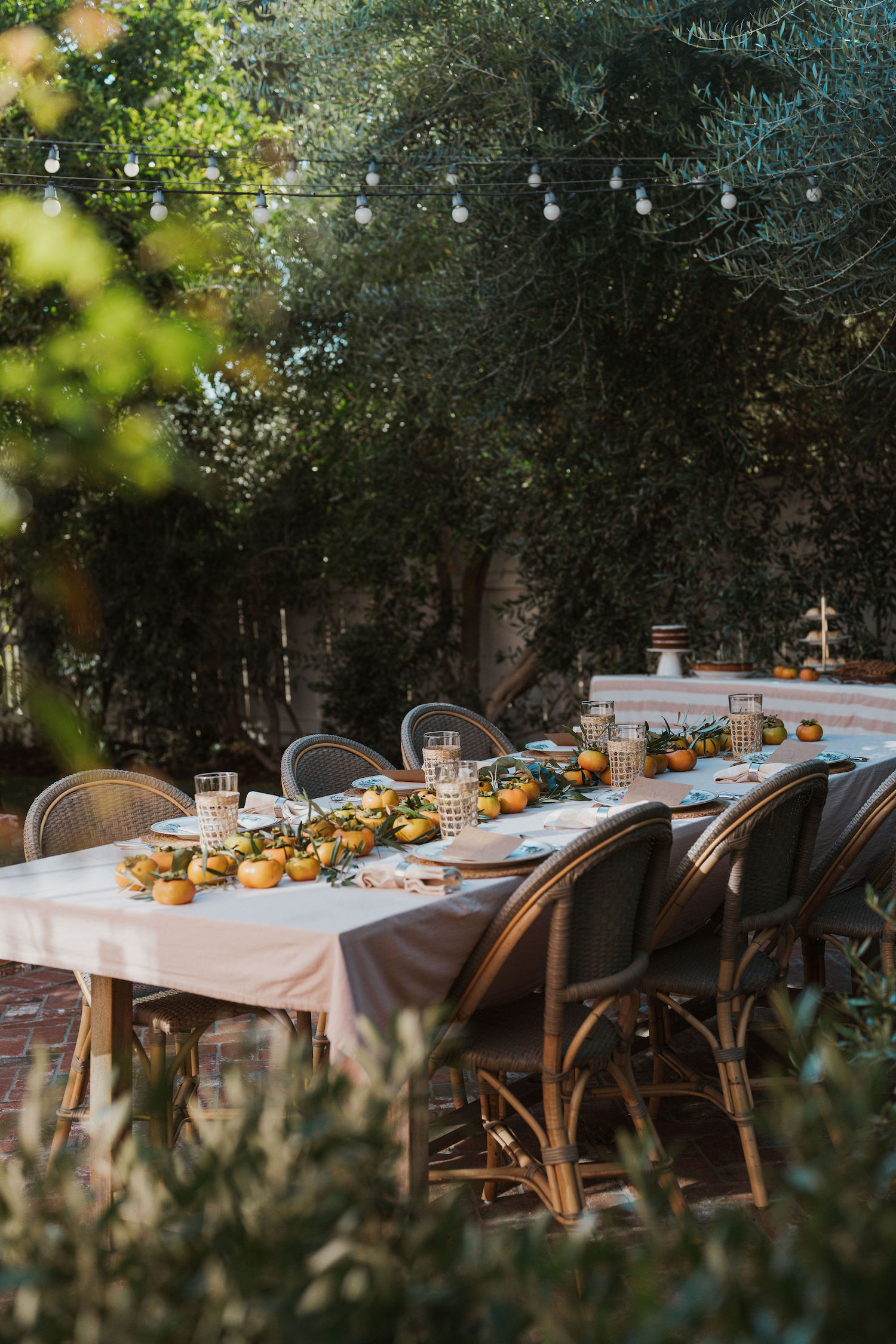 Laurel Gallucci, Sweet Laurel founder, Friendsgiving Brunch at Home in Los Angeles, backyard dinner party table, spring, persimmons