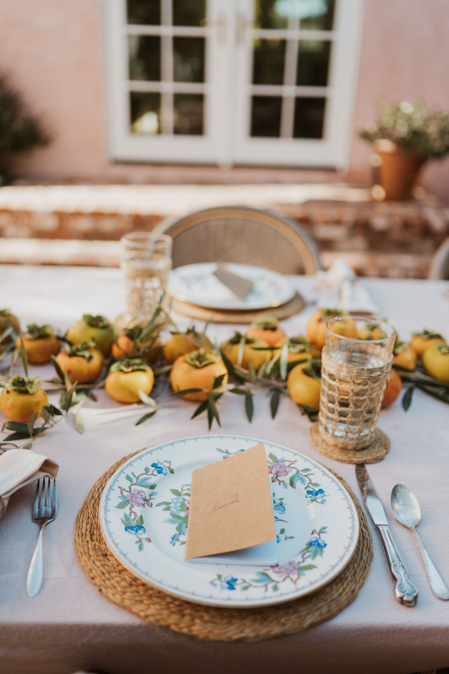 Laurel Gallucci, Sweet Laurel founder, Friendsgiving Brunch at Home in Los Angeles, backyard dinner party table, spring, persimmons, place setting