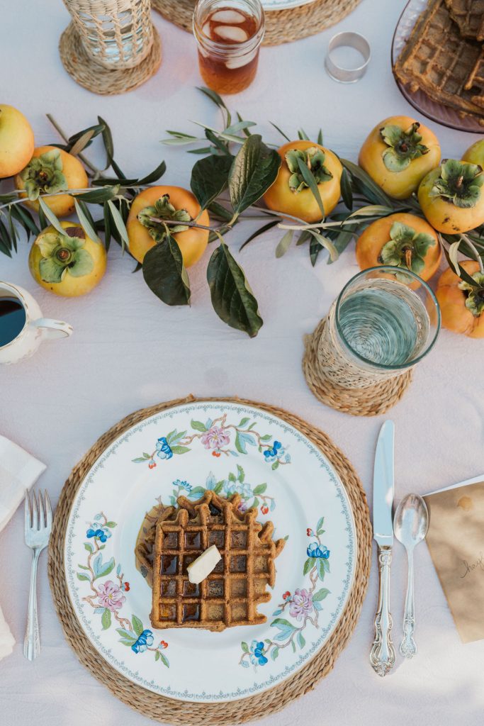 Laurel Gallucci, Sweet Laurel founder, Friendsgiving Brunch at Home in Los Angeles, backyard dinner party table, spring, persimmons, place setting, waffles