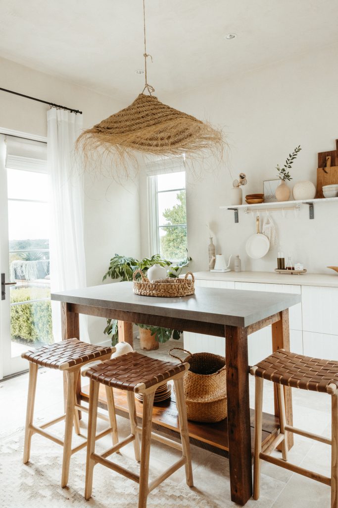 camille styles studio kitchen, woven light fixture pendant, island with stools