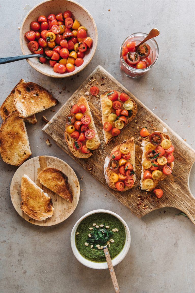 Tomato bruschetta and green pesto.