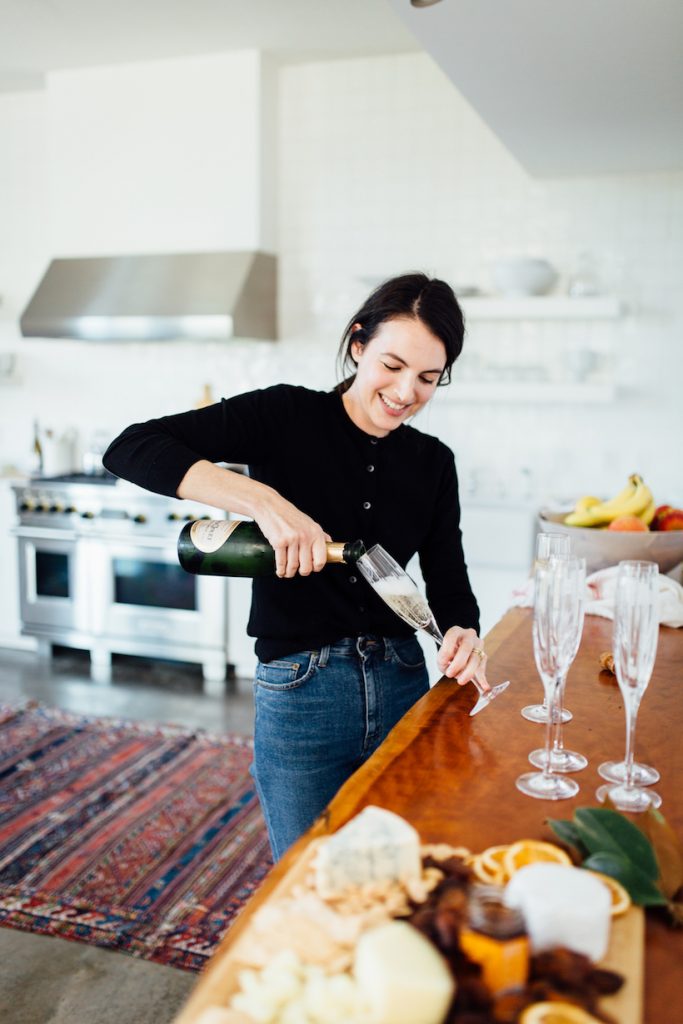 woman pouring champagne