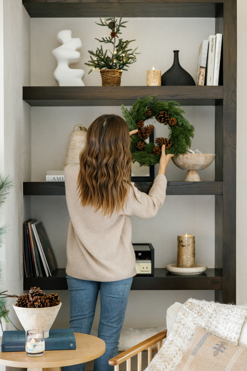 Camille Styles holiday decor greenery garlands, mantel, living room shelves- wreath