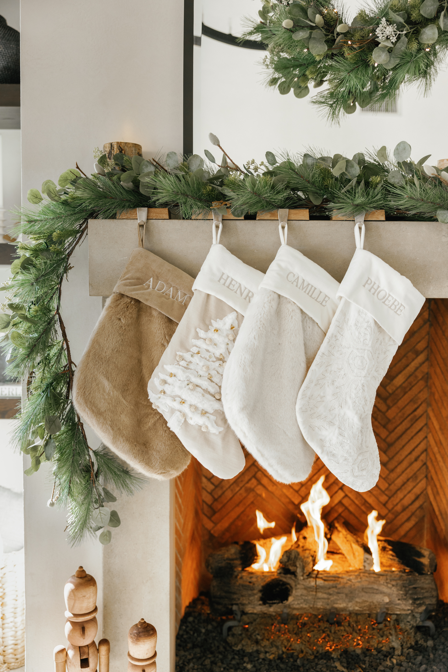 Camille Styles holiday decor greenery gamantel, hanging stockings