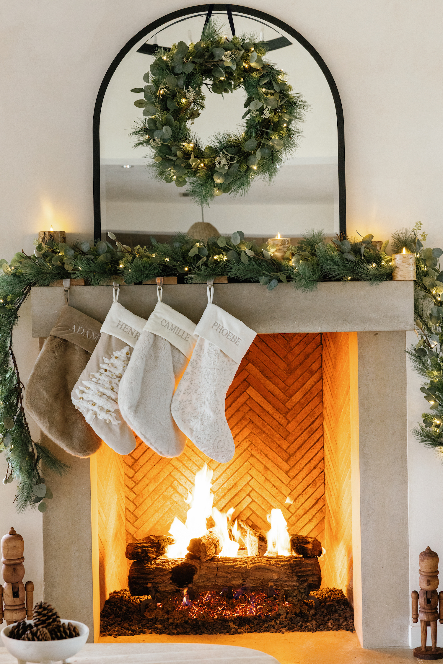 Camille Styles holiday decor greenery garlands, mantel, hanging stockings