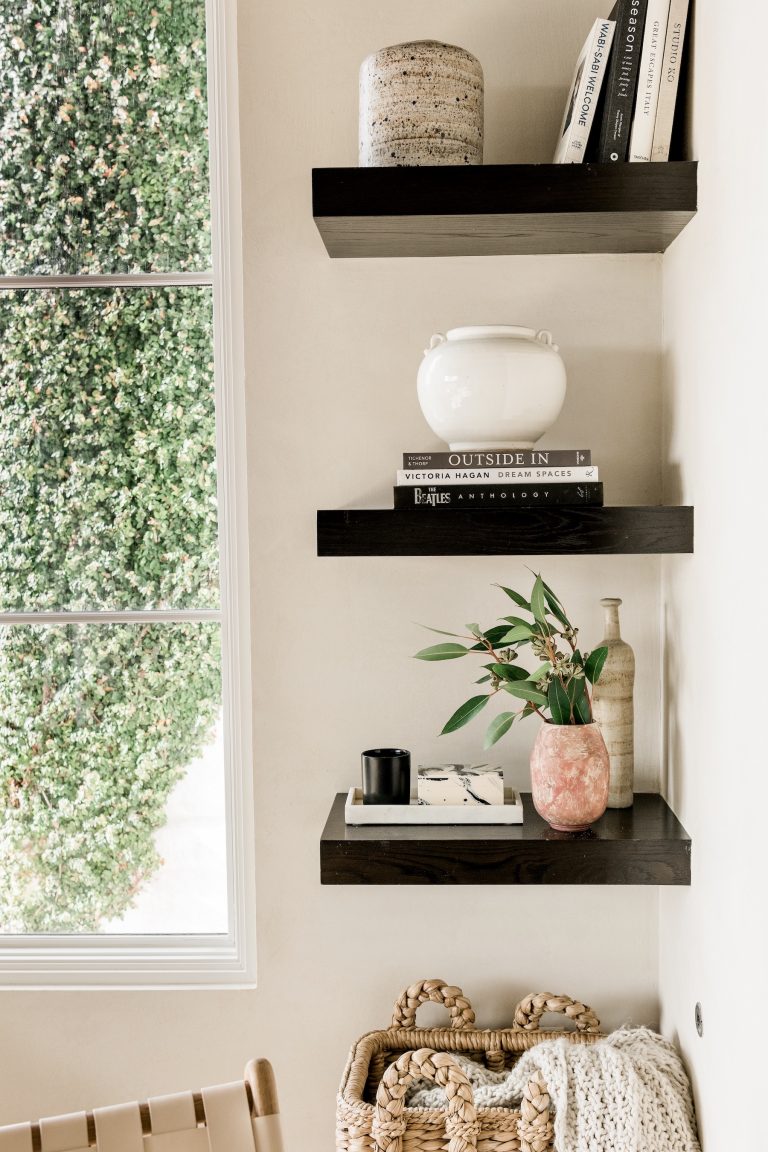 tan living room with shelves