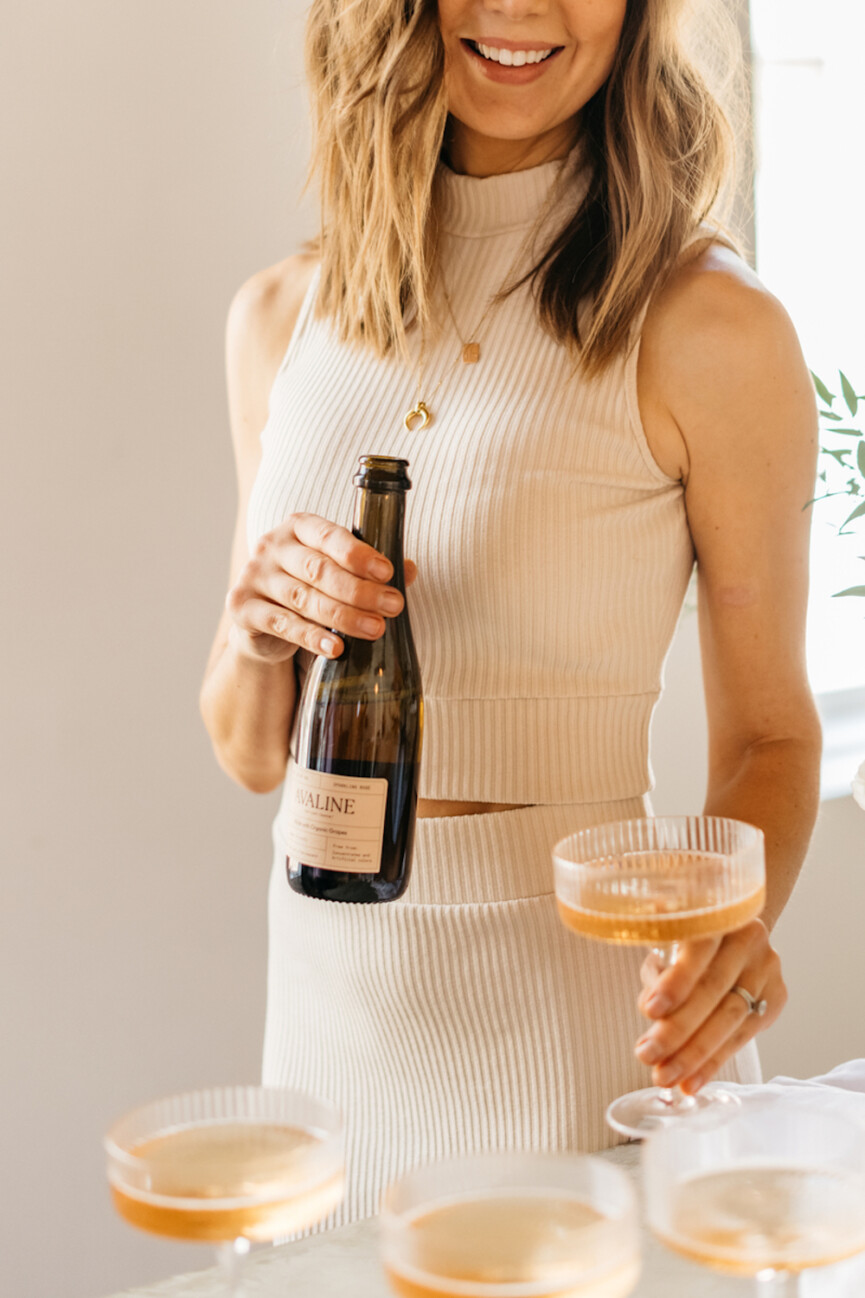 Pouring champagne.