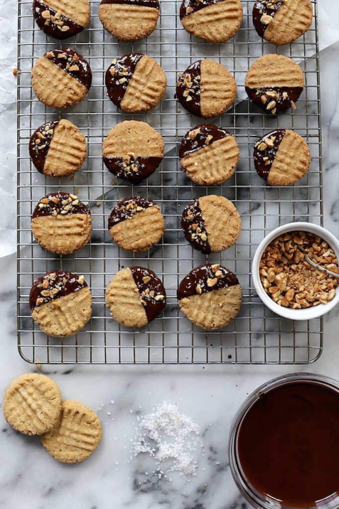 https://camillestyles.com/wp-content/uploads/2022/12/chocolate-dipped-crisp-peanut-butter-cookies.jpeg