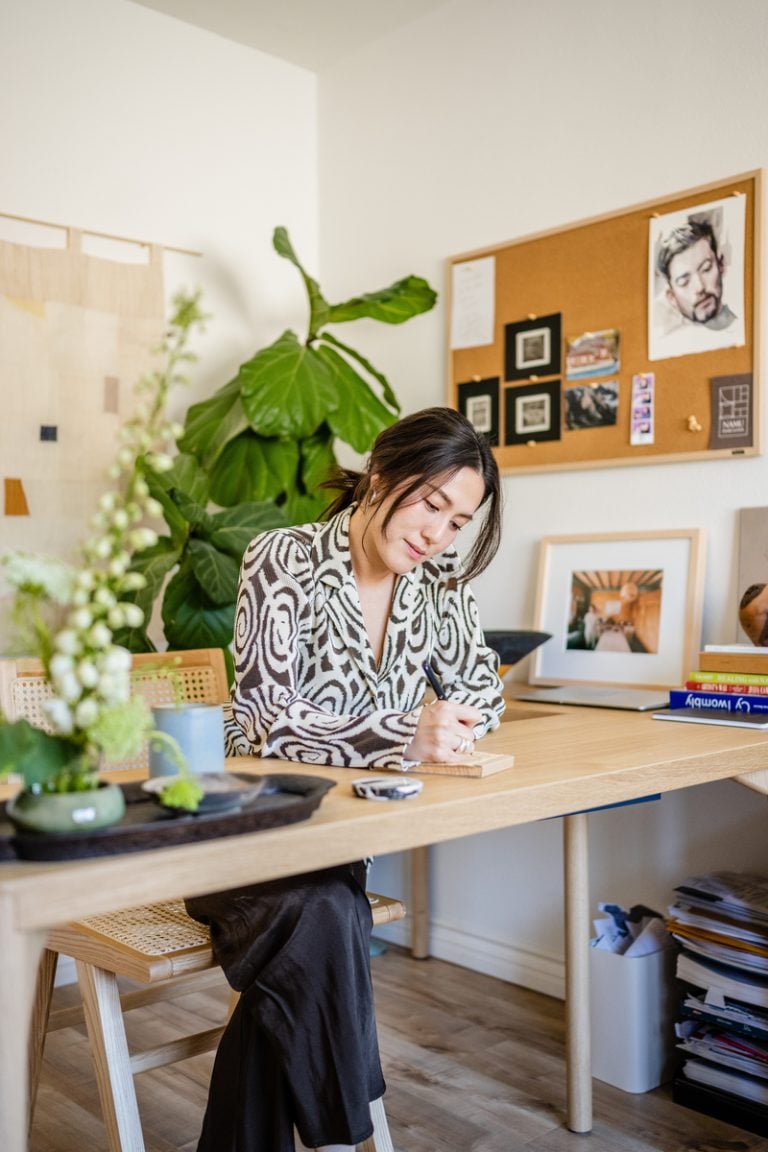 woman working at desk what's going to save my life in 2023