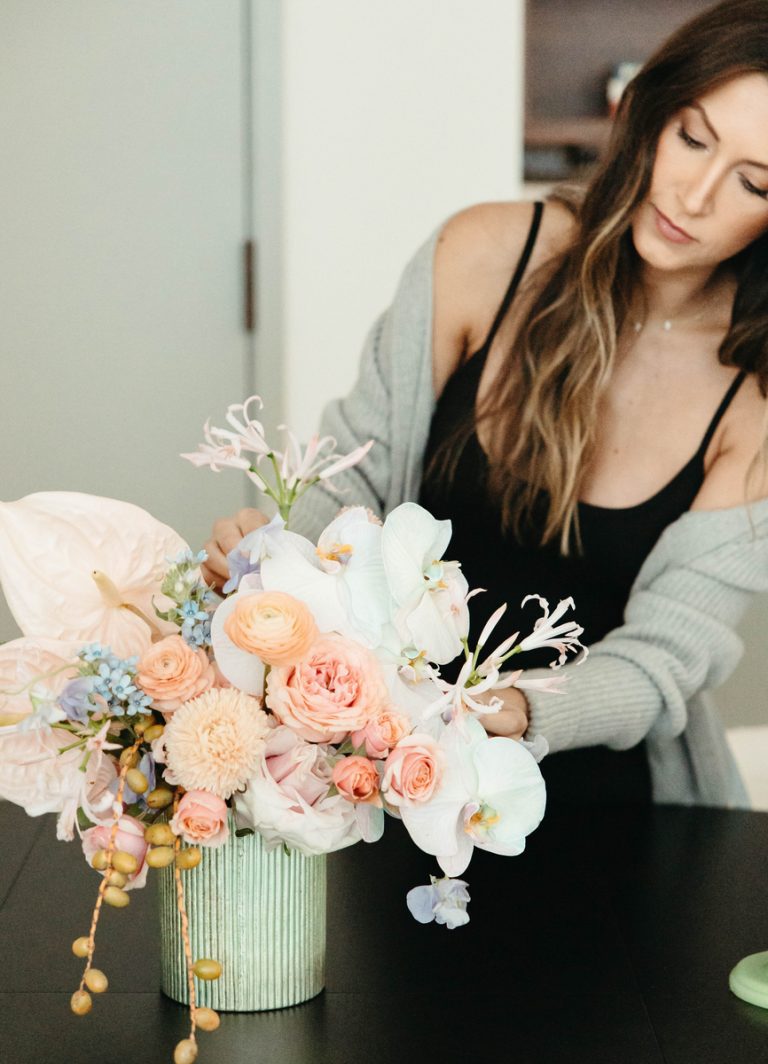 woman arranging flowers what's going to save my life in 2023
