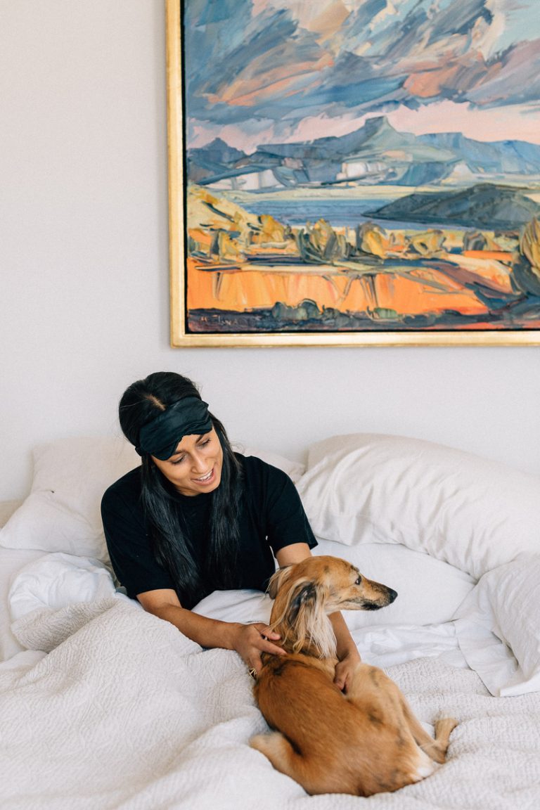 Shani van Breukelen petting dog in bed alcohol and sleep