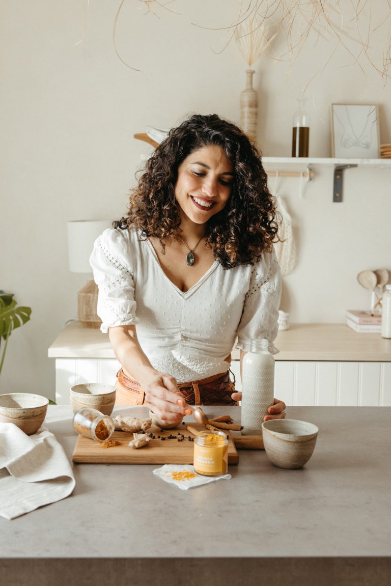 Woman making golden milk