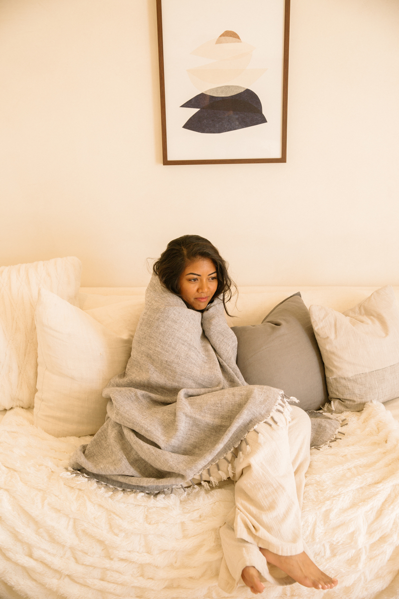 Woman cozy in bed_postpartum nutrition