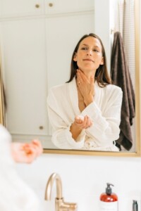 Woman washing neck.