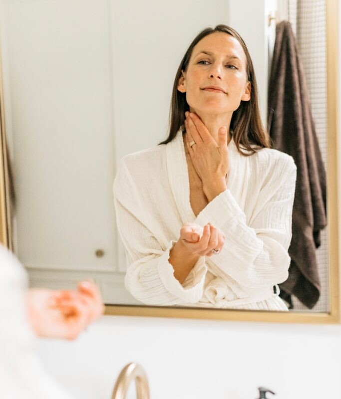 Woman washing neck.